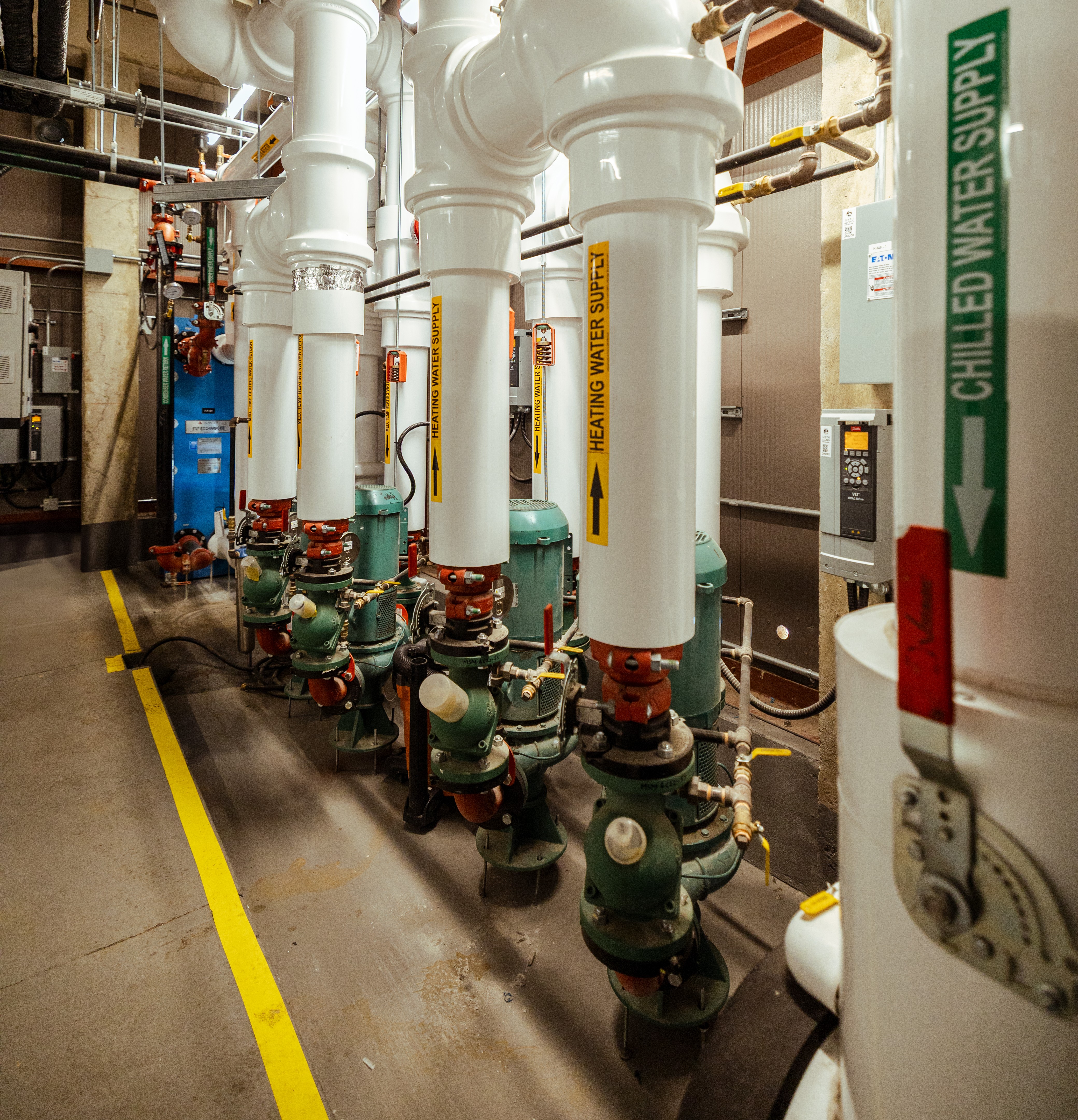 Hands pointing at book on table